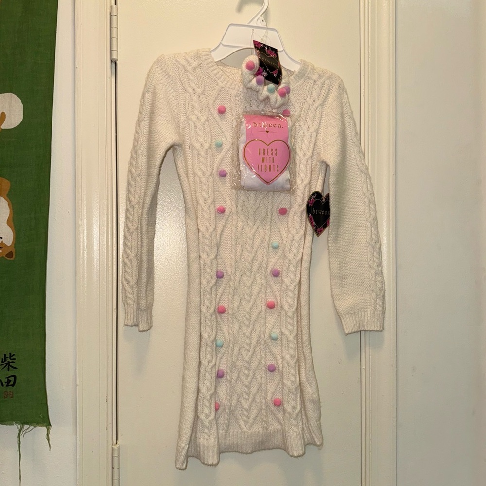 Btween sweater dress with tights and hair tie